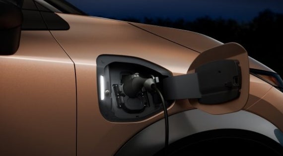 Close-up image of charging cable plugged in | Nissan of Gilroy in Gilroy CA